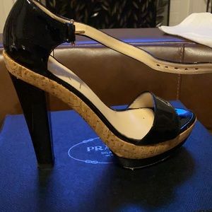 Black patent leather platform heels.